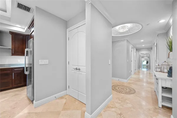 a bedroom with bed and a large window