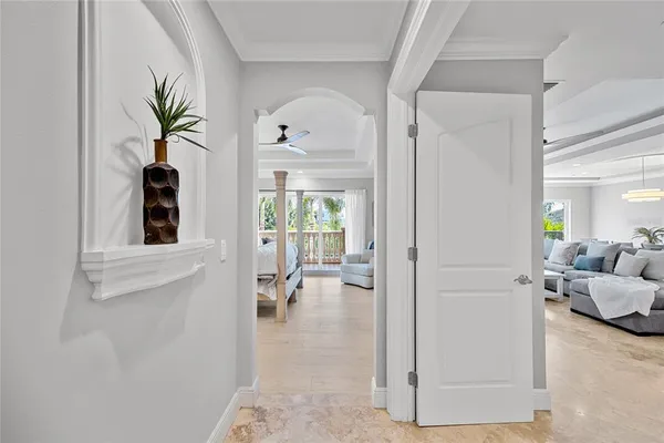 a bedroom with a bed and a view of balcony