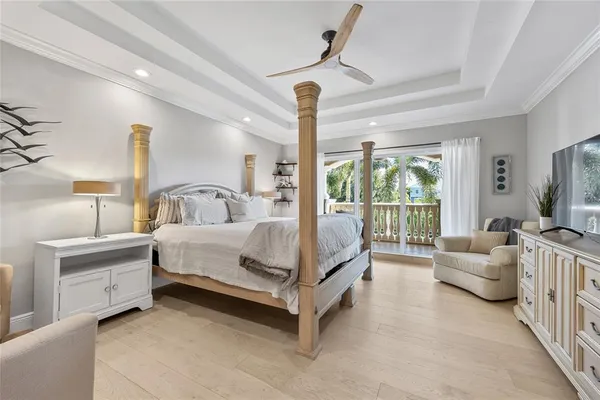 a porch with a bench next to a yard