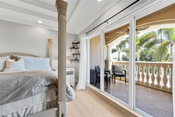 a bedroom with a flat screen television and a bed