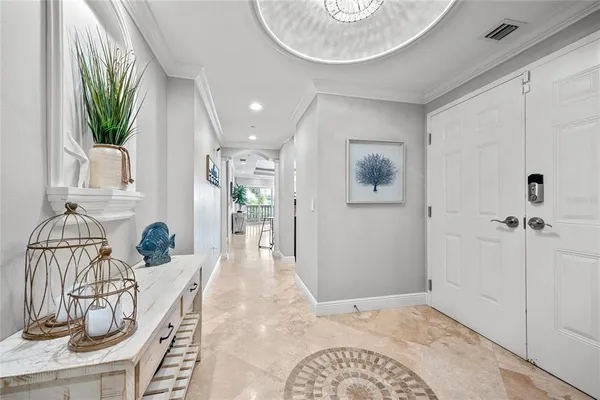 a living room with furniture and a ceiling fan