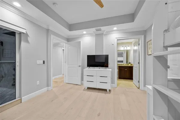 a spacious bedroom with a bed and a walk in closet