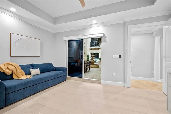 a bedroom with a bed and flat screen tv
