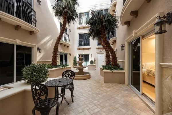 a kitchen with a refrigerator and a stove