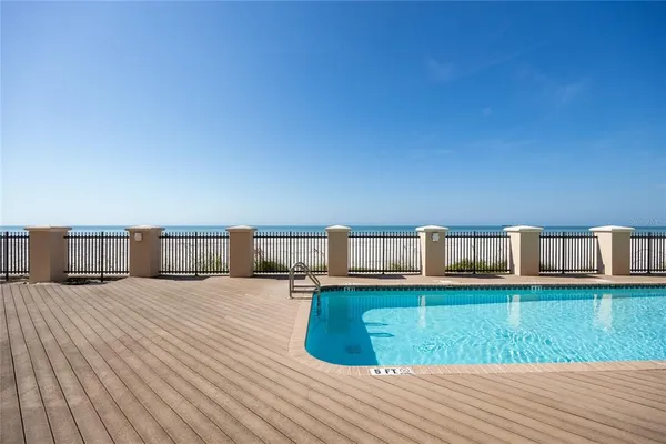a view of a swimming pool with a lounge chairs