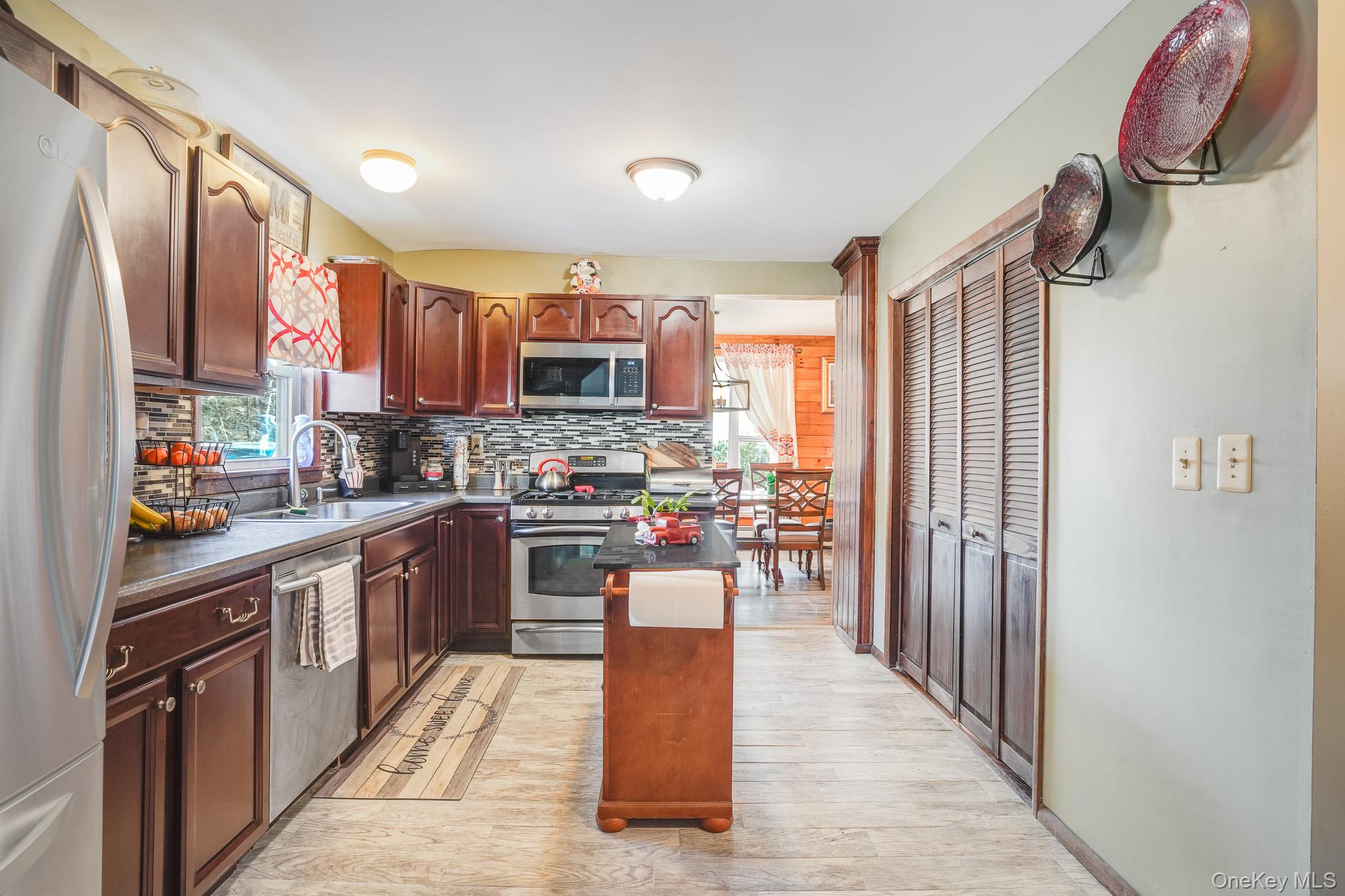 11 Gale Road Mongaup Valley, NY 12762 - Photo 11 of 39 a kitchen with stainless steel appliances granite countertop a refrigerator a stove top oven a sink and dishwasher