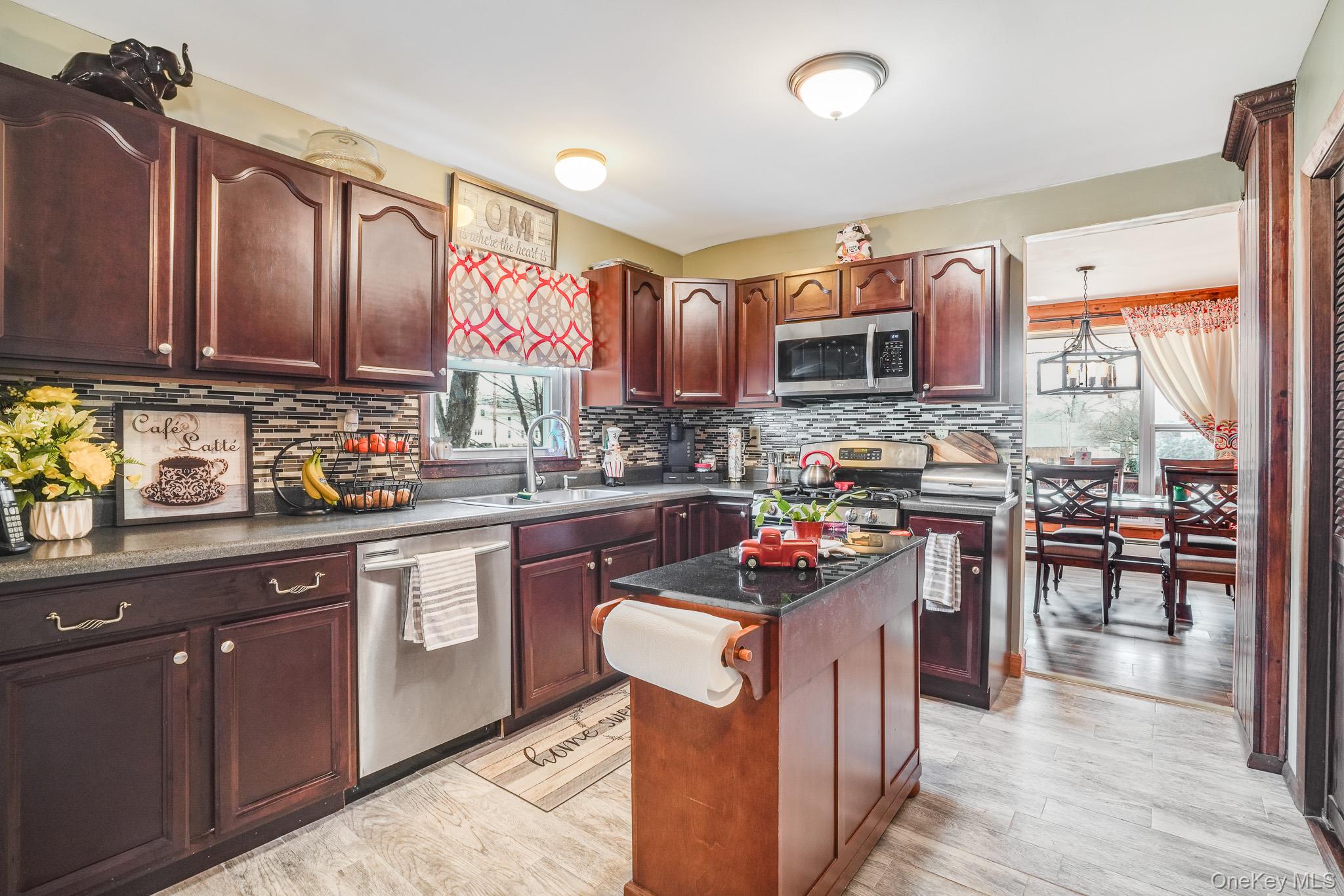 11 Gale Road Mongaup Valley, NY 12762 - Photo 12 of 39 a kitchen with a stove top oven sink and cabinets