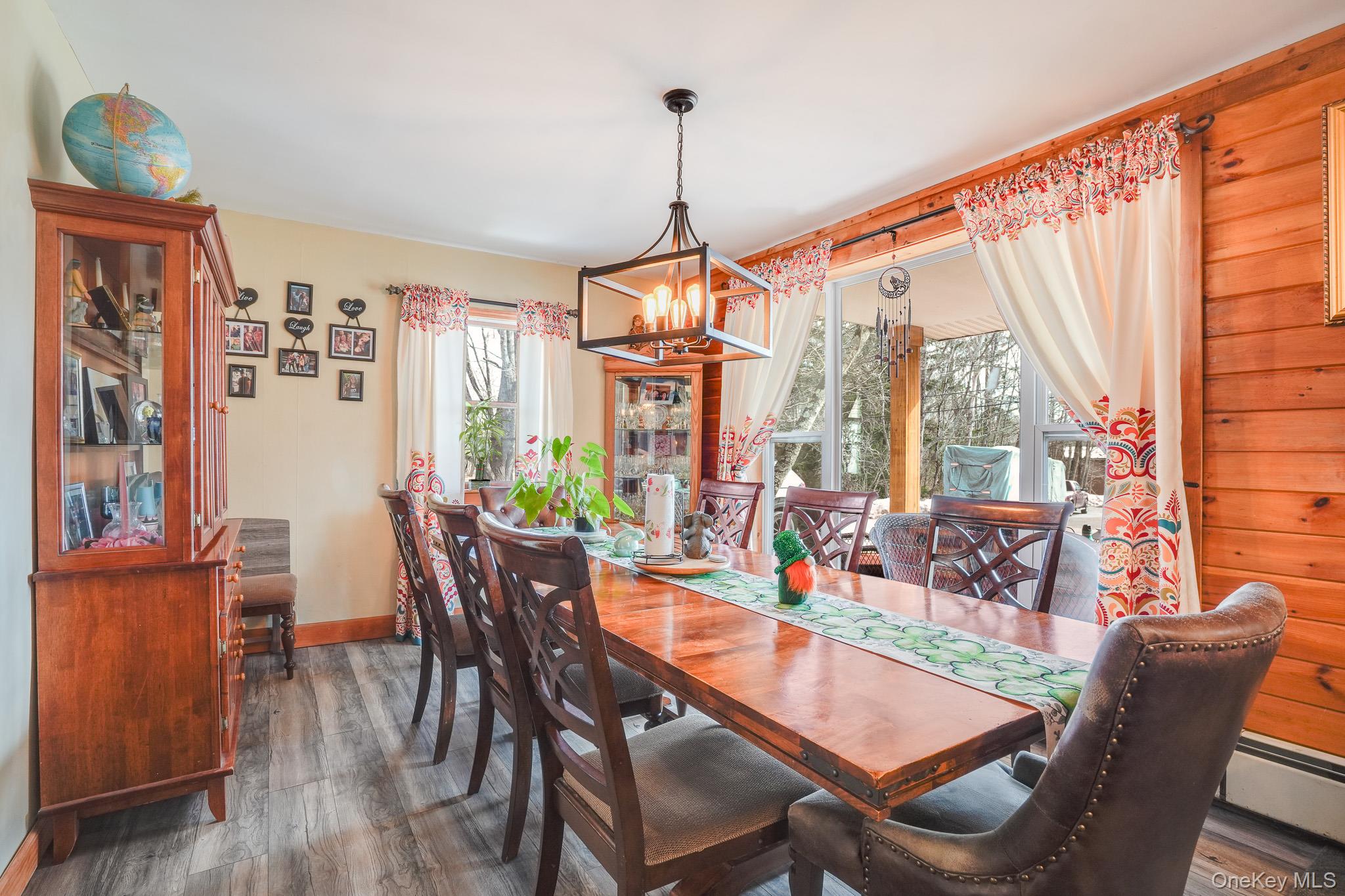 11 Gale Road Mongaup Valley, NY 12762 - Photo 14 of 39 a dining room with furniture a chandelier and wooden floor