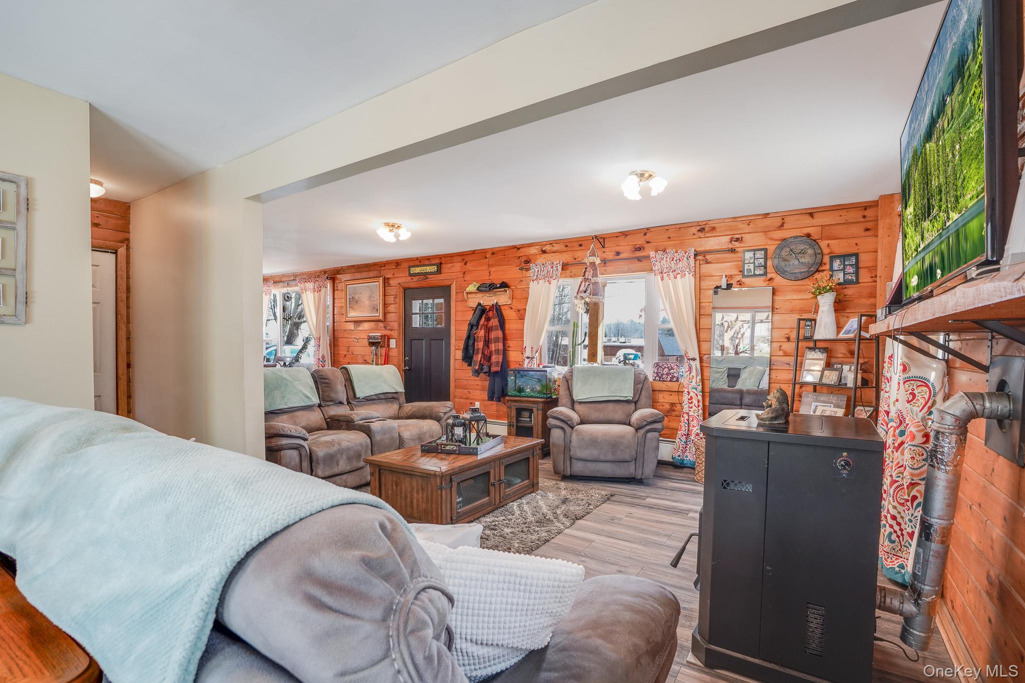 11 Gale Road Mongaup Valley, NY 12762 - Photo 8 of 39 a living room with furniture large windows and flat screen tv