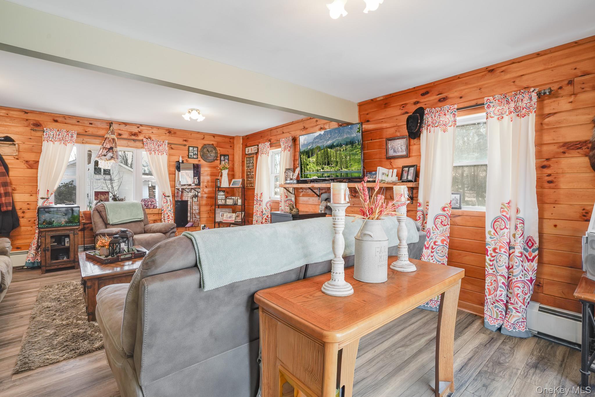 11 Gale Road Mongaup Valley, NY 12762 - Photo 9 of 39 a living room filled with furniture and a floor to ceiling window