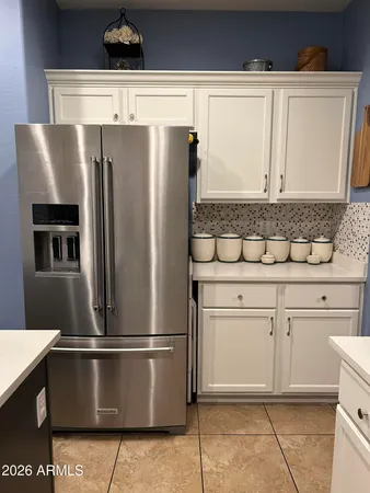 a kitchen with stainless steel appliances a sink and a refrigerator
