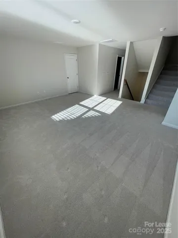 a bathroom with a shower and a sink