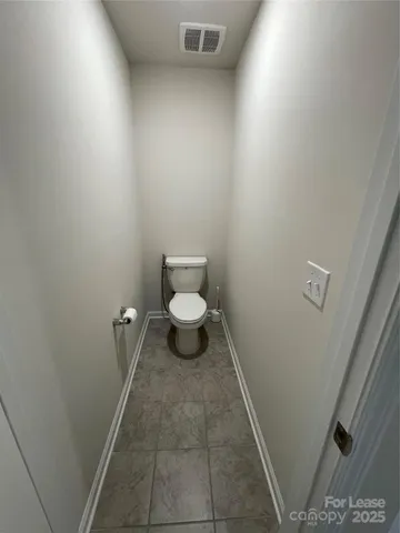 a spacious bathroom with a double vanity sink and mirror