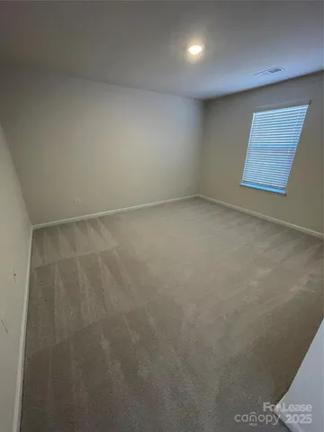 a white toilet sitting next to a shower curtain