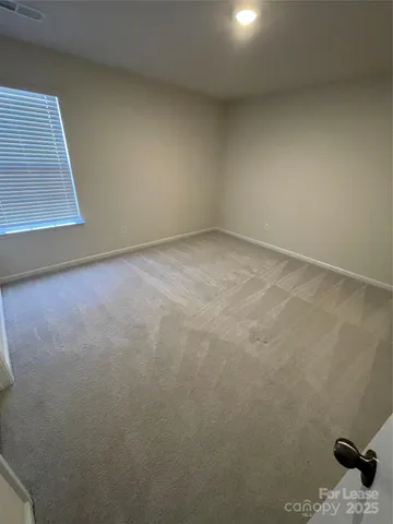 a bathroom with a double vanity sink and mirror