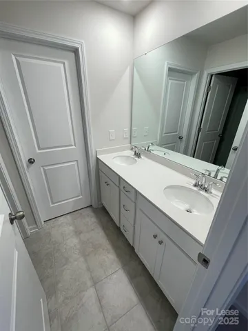 a view of a yard with snow on the road