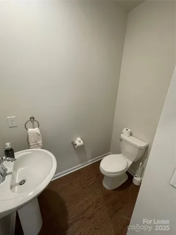 a bathroom with a double vanity sink toilet and shower
