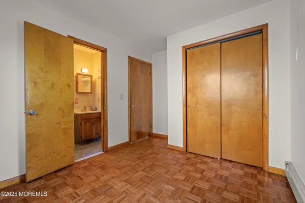 a bathroom with a sink toilet and mirror