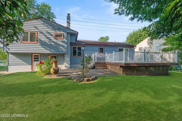 a view of a livingroom with wooden floor and a window