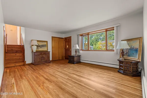 a metallic refrigerator freezer sitting in a kitchen