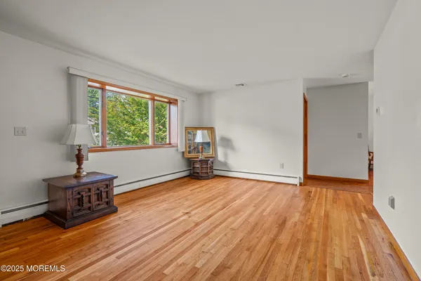 a kitchen with stainless steel appliances granite countertop a refrigerator a stove and a sink with cabinets