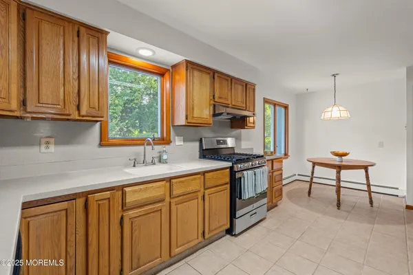 a view of a livingroom with furniture window and wooden floor