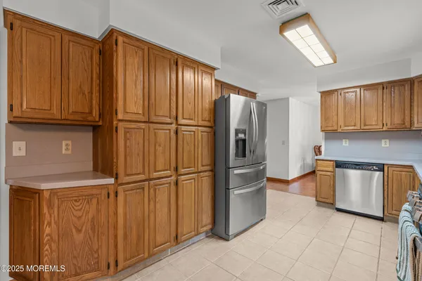 a view of an empty room with stairs