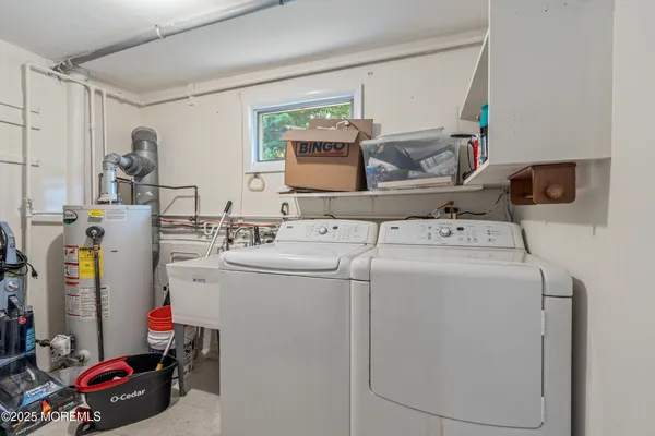 a front view of a house with a yard and tree s