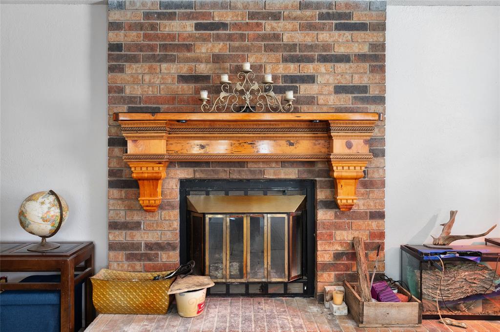 101 Frazier Oaks Road Pottsboro, TX 75076 - Photo 11 of 36 a living room with furniture and a fireplace