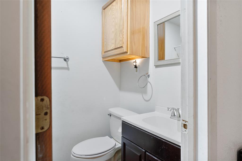 101 Frazier Oaks Road Pottsboro, TX 75076 - Photo 24 of 36 a bathroom with a granite countertop sink toilet and shower