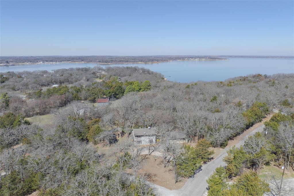 101 Frazier Oaks Road Pottsboro, TX 75076 - Photo 32 of 36 a view of a dry field with trees in background