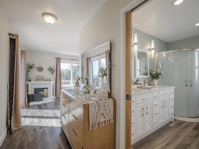 a very nice looking room with a large window and wooden floor