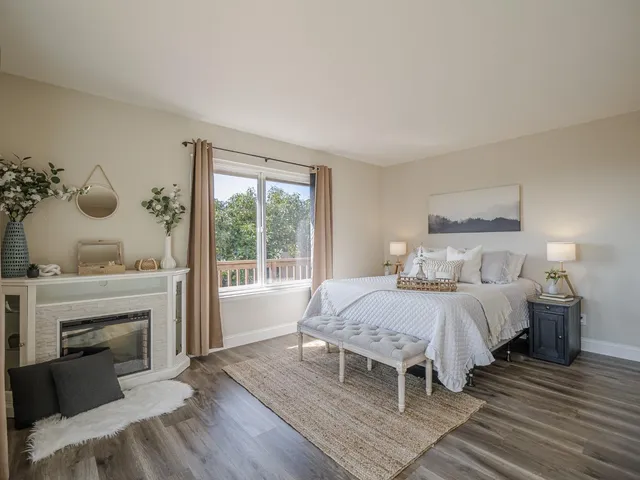 a bedroom with a bed and a fireplace