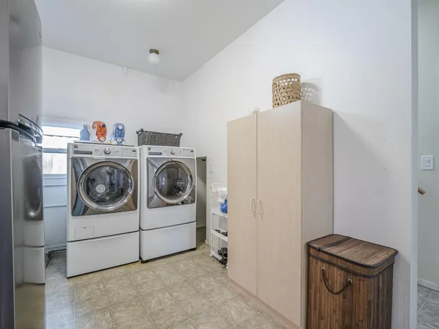 a utility room with dryer and washer