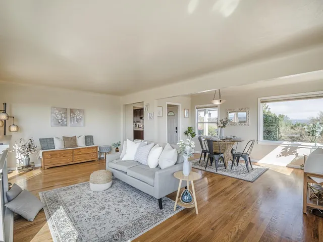 a living room with furniture and a table