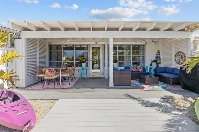 a view of a chairs and table in patio