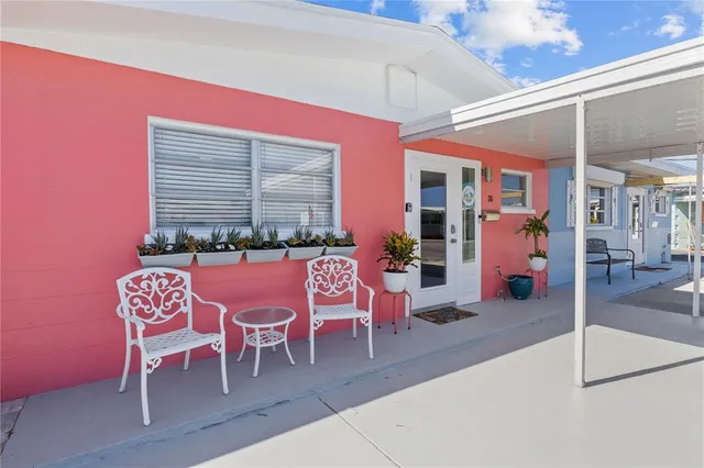 a dinning table and chairs in the patio
