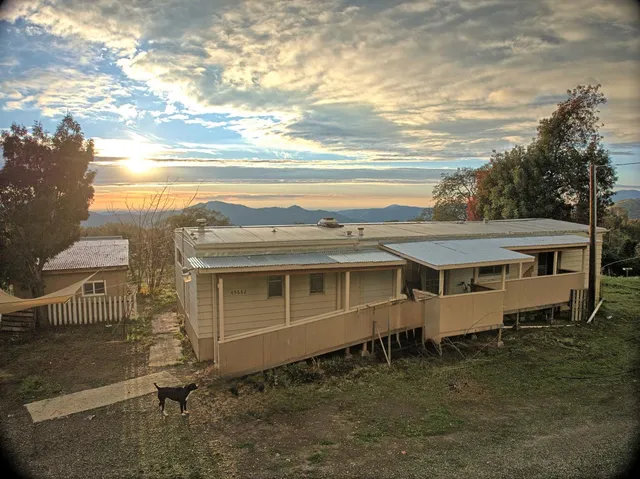 a aerial view of a house with a yard