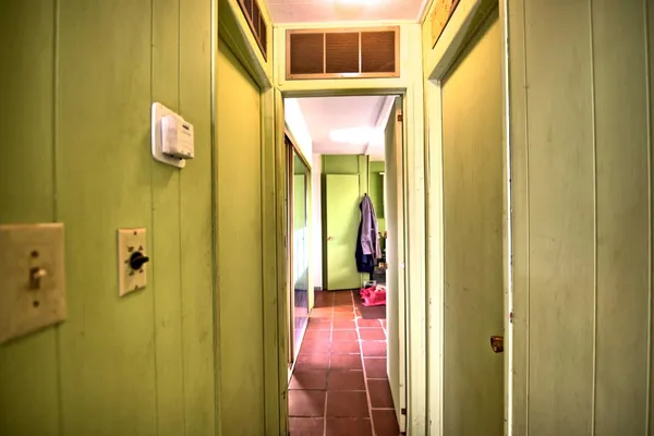 a bathroom with a mirror and a shower