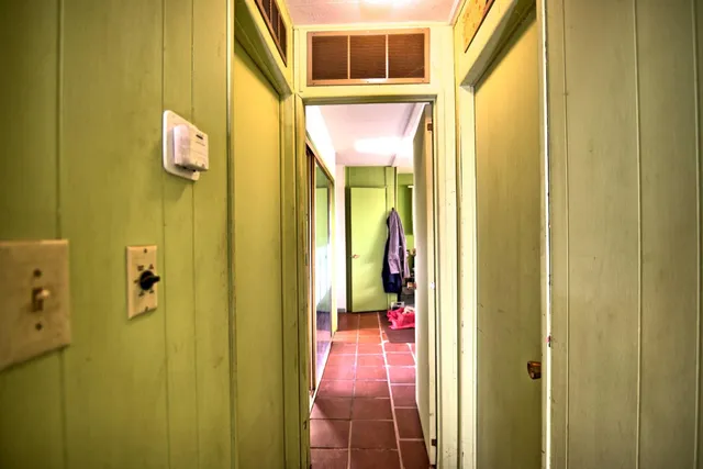a bathroom with a mirror and a shower