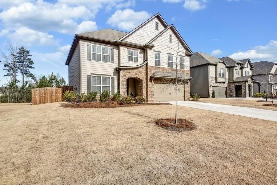 6460 Country Lake Road Cumming, GA 30041 - Photo 1 of 1 Beautiful stone, shake & hardiplank home with a great lot