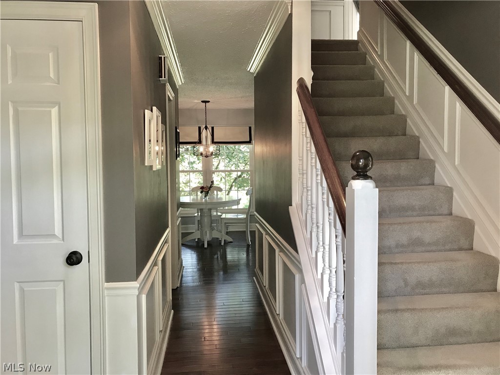 2231 Middleton Road Hudson, OH 44236 - Photo 14 of 28 Hardwood floors and wainscoting welcome guests. Front foyer pictured guest closet pictured on left. Dining room to the immediate left and Living room to the right.