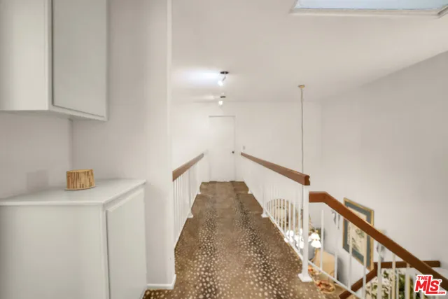 a view of a hallway with staircase