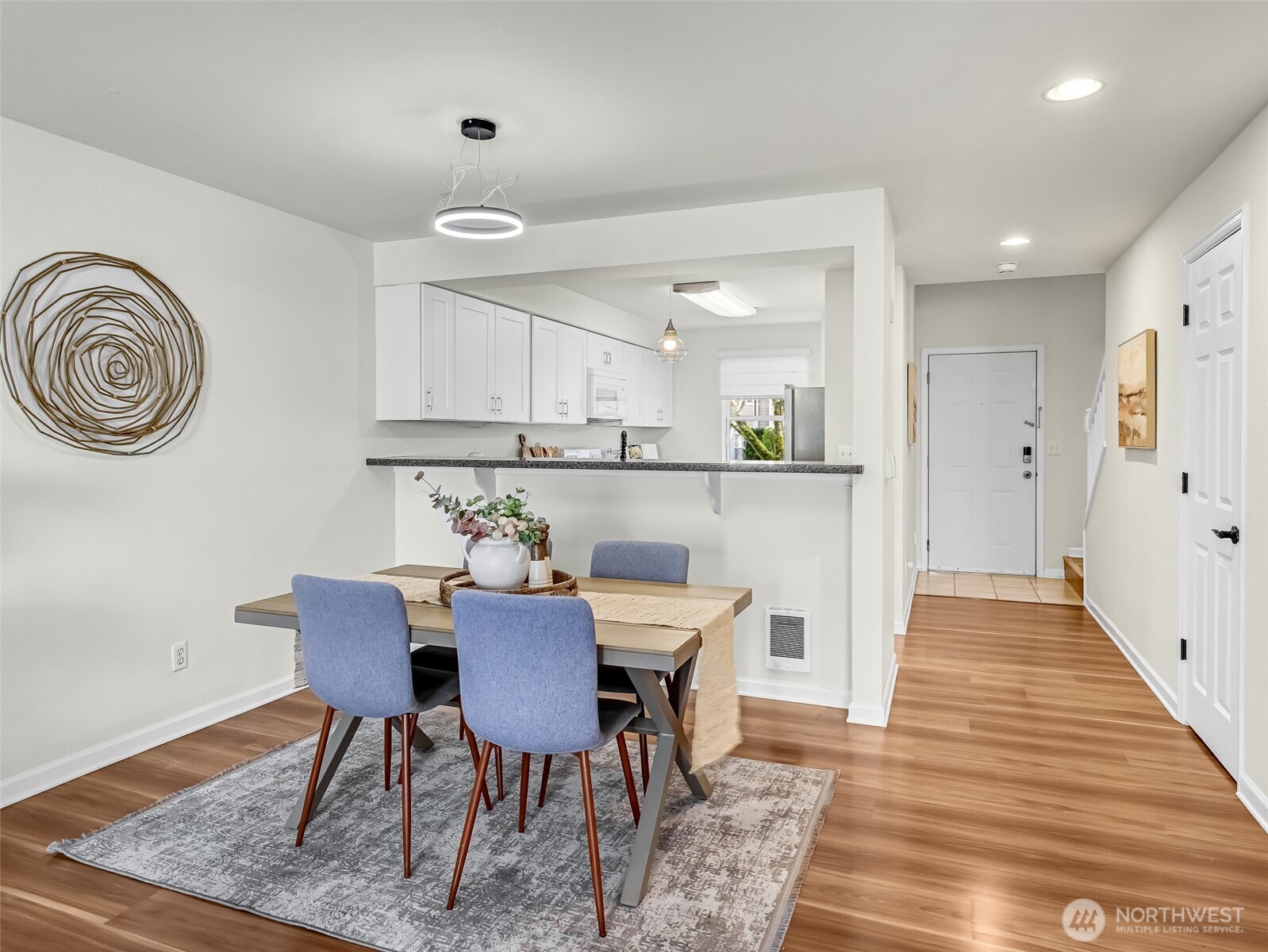 2300 Jefferson Avenue Northeast, Unit I137 Renton, WA 98056 - Photo 14 of 40 a view of a dining room with furniture and wooden floor