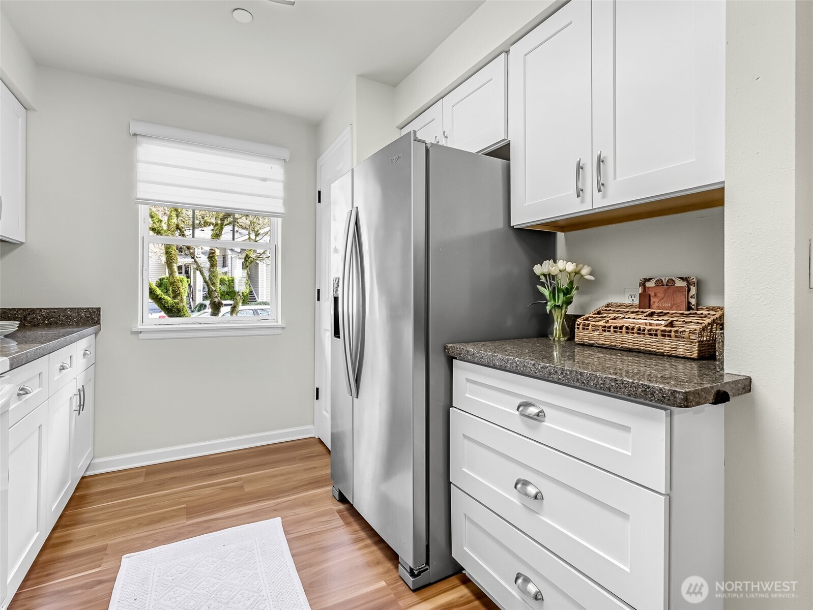 2300 Jefferson Avenue Northeast, Unit I137 Renton, WA 98056 - Photo 17 of 40 a kitchen with granite countertop cabinets and stainless steel appliances