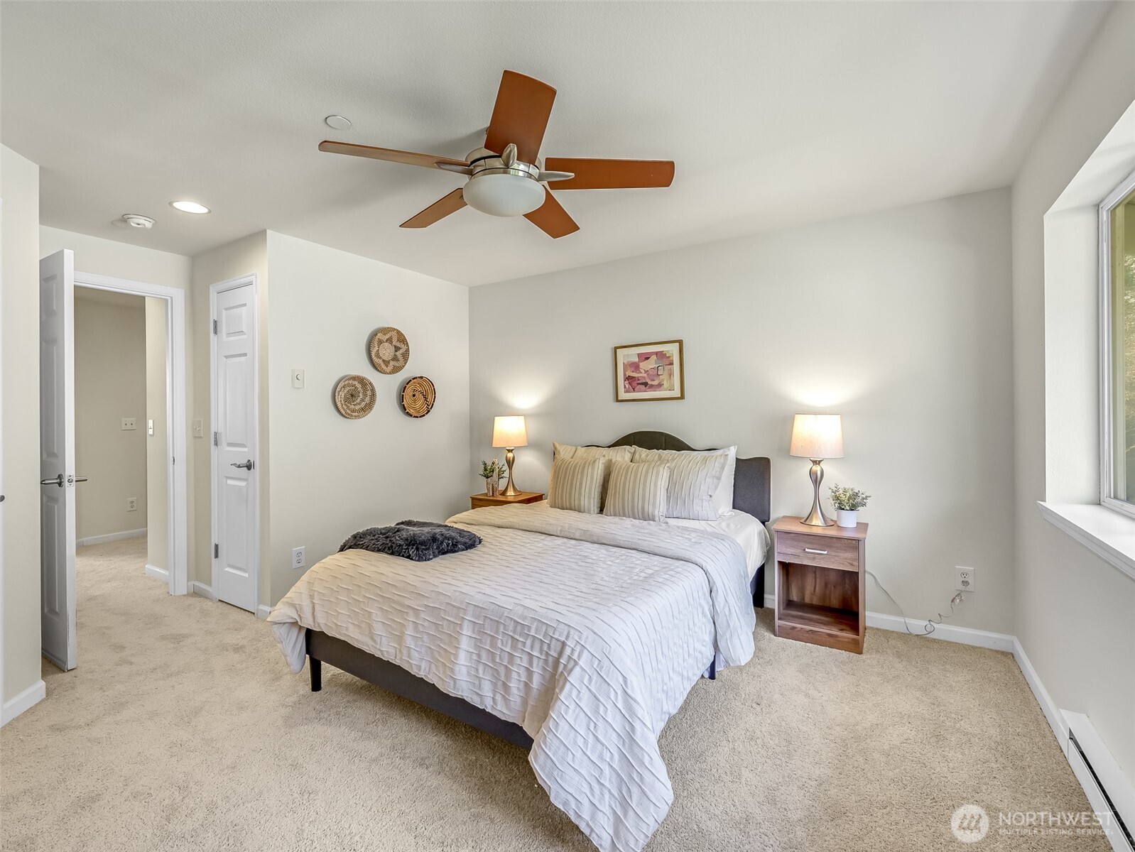 2300 Jefferson Avenue Northeast, Unit I137 Renton, WA 98056 - Photo 27 of 40 a bedroom with a bed and a chandelier