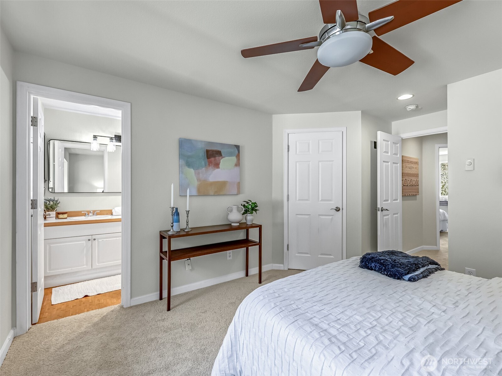 2300 Jefferson Avenue Northeast, Unit I137 Renton, WA 98056 - Photo 28 of 40 a bedroom with a bed and a chandelier