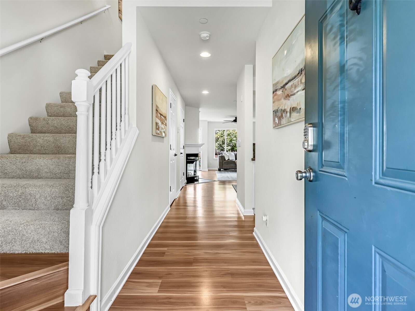 2300 Jefferson Avenue Northeast, Unit I137 Renton, WA 98056 - Photo 3 of 40 a view of a hallway with wooden floor and staircase