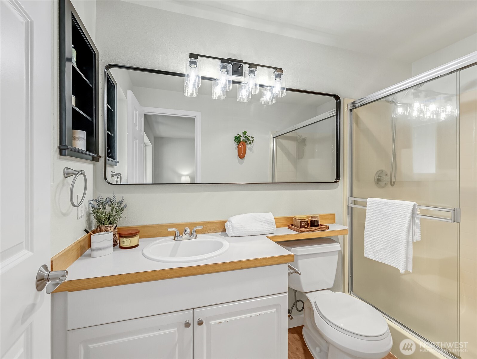 2300 Jefferson Avenue Northeast, Unit I137 Renton, WA 98056 - Photo 31 of 40 a bathroom with a sink vanity mirror and toilet