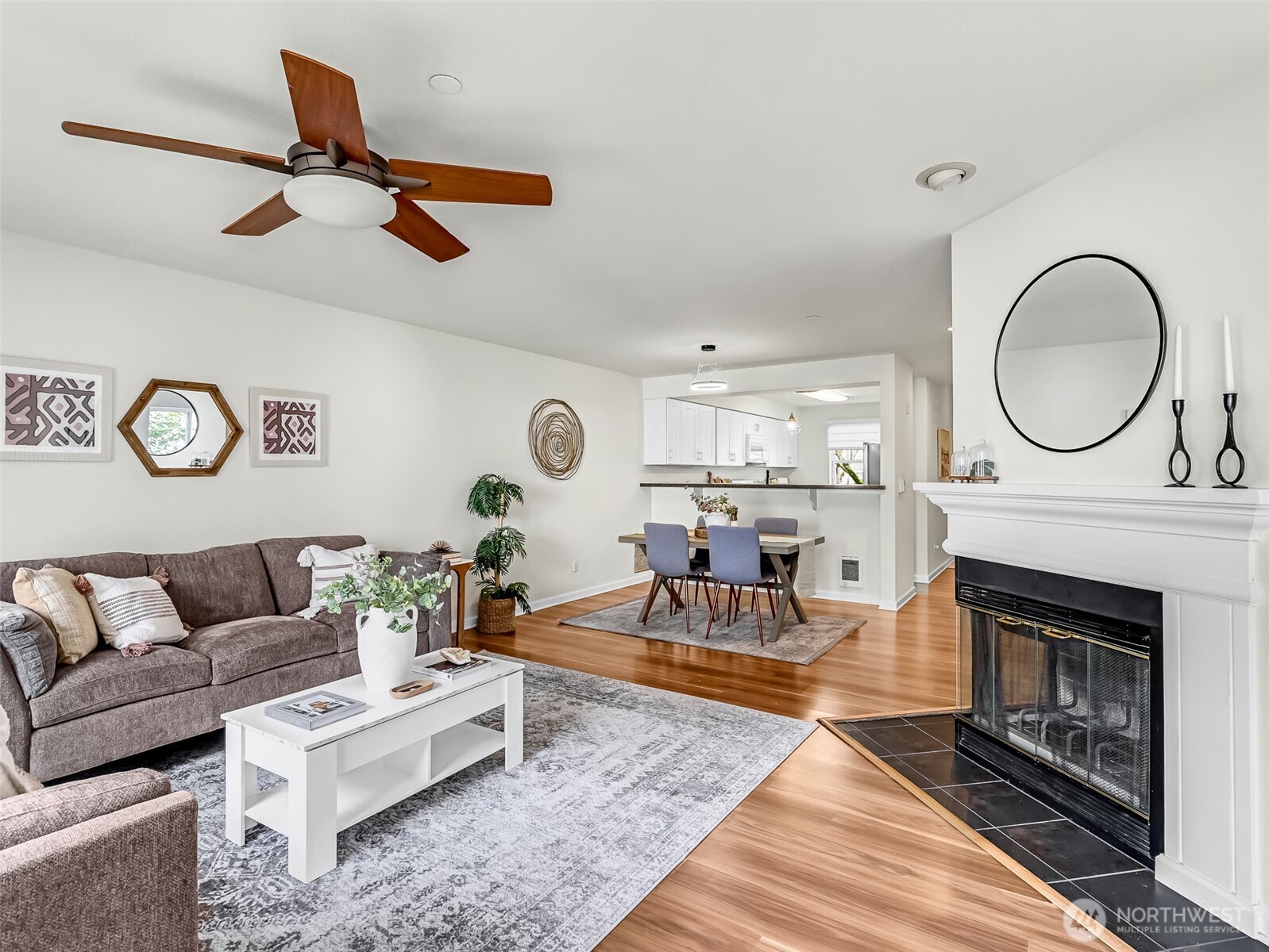 2300 Jefferson Avenue Northeast, Unit I137 Renton, WA 98056 - Photo 4 of 40 a living room with furniture and a fireplace